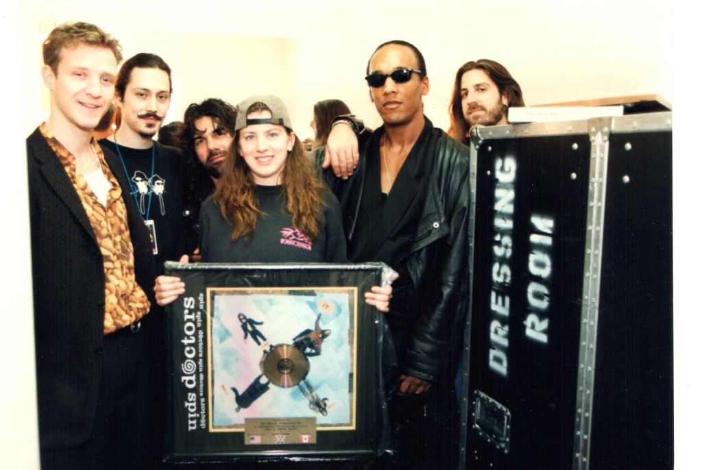 Michelle being presented a gold record from Spin Doctors circa 1994